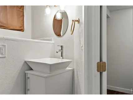 a bathroom with a sink vanity and a mirror