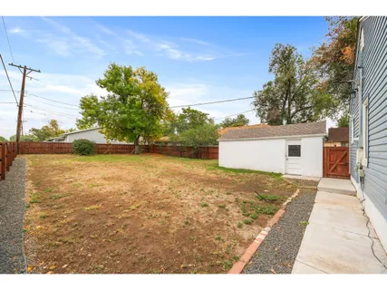 a view of a backyard of the house