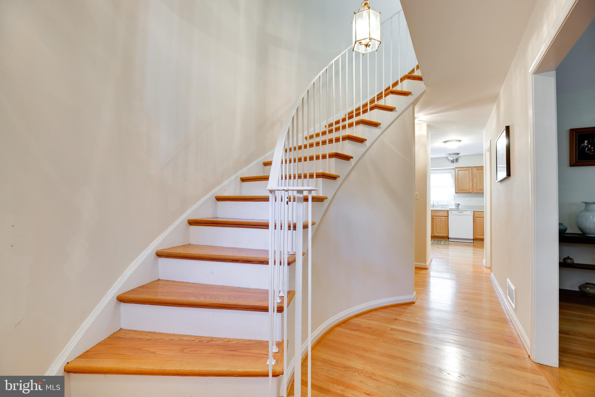 8331 Wickham Road Springfield, VA 22152 - Photo 2 of 31 greeting with curve staircase