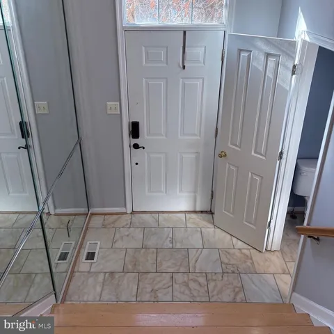 a kitchen with stainless steel appliances a refrigerator sink and microwave