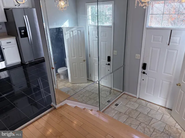 a kitchen with stainless steel appliances a stove a sink and a refrigerator