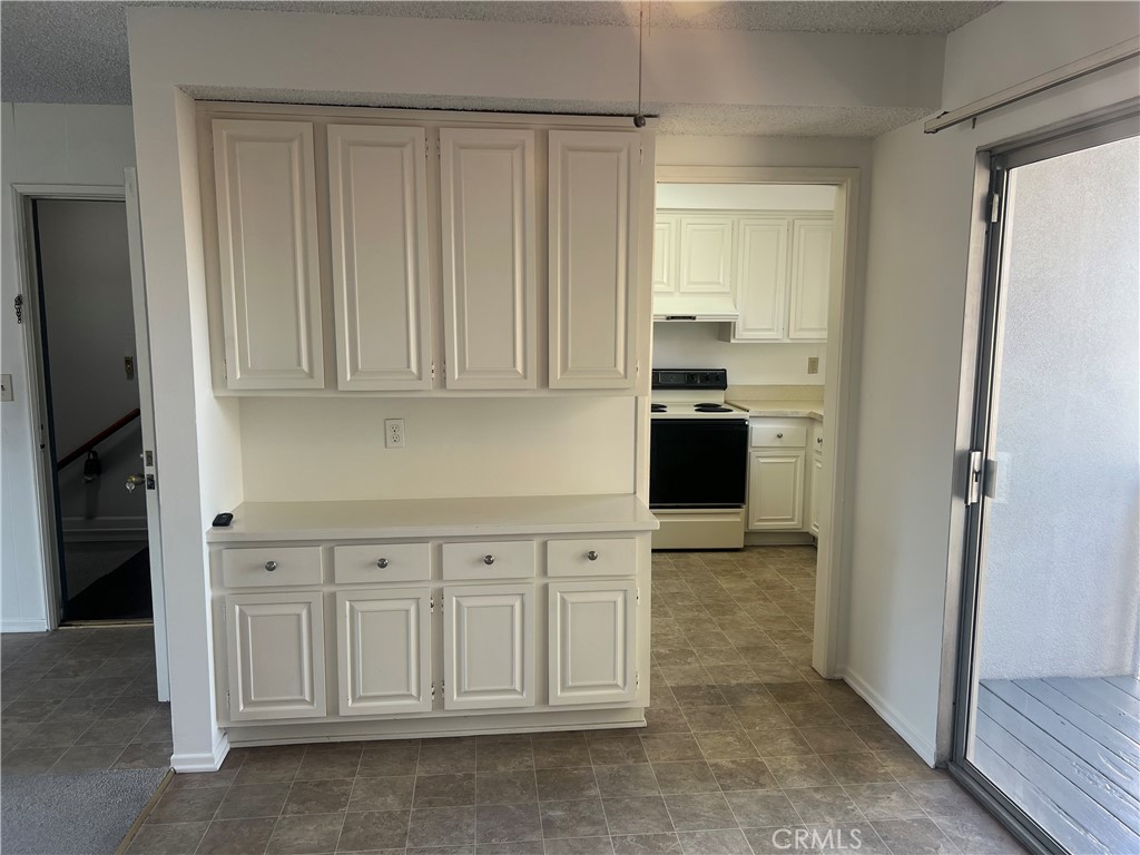 1912 Bataan Road Redondo Beach, CA 90278 - Photo 12 of 37 a view of a kitchen with white cabinets