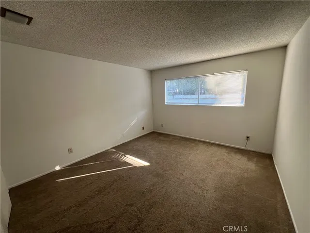 a view of a balcony with wooden floor