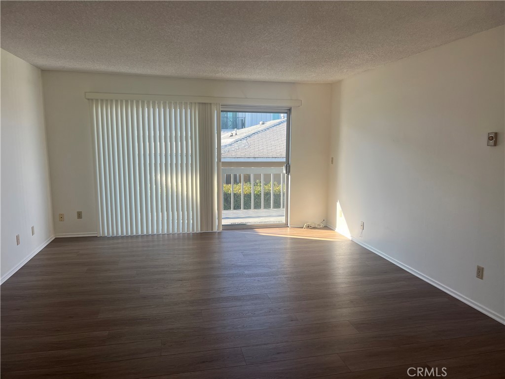 1912 Bataan Road Redondo Beach, CA 90278 - Photo 34 of 37 a view of an empty room with wooden floor and a window