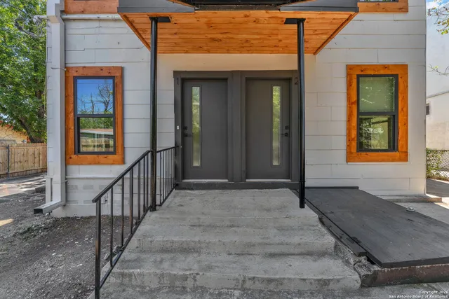 a view of stairs and wooden floor