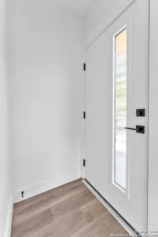 a bathroom with a shower and mirror