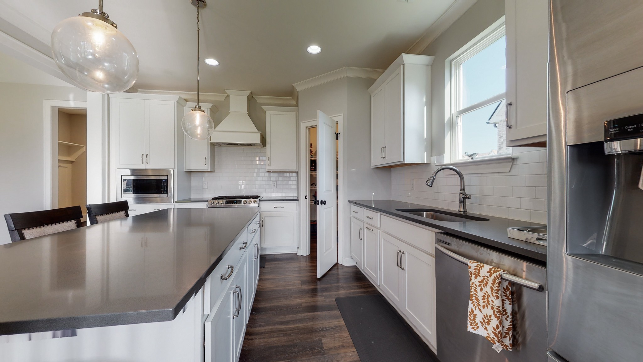 757 Plowson Road Mount Juliet, TN 37122 - Photo 17 of 48 a kitchen with stainless steel appliances granite countertop a sink a stove and a refrigerator