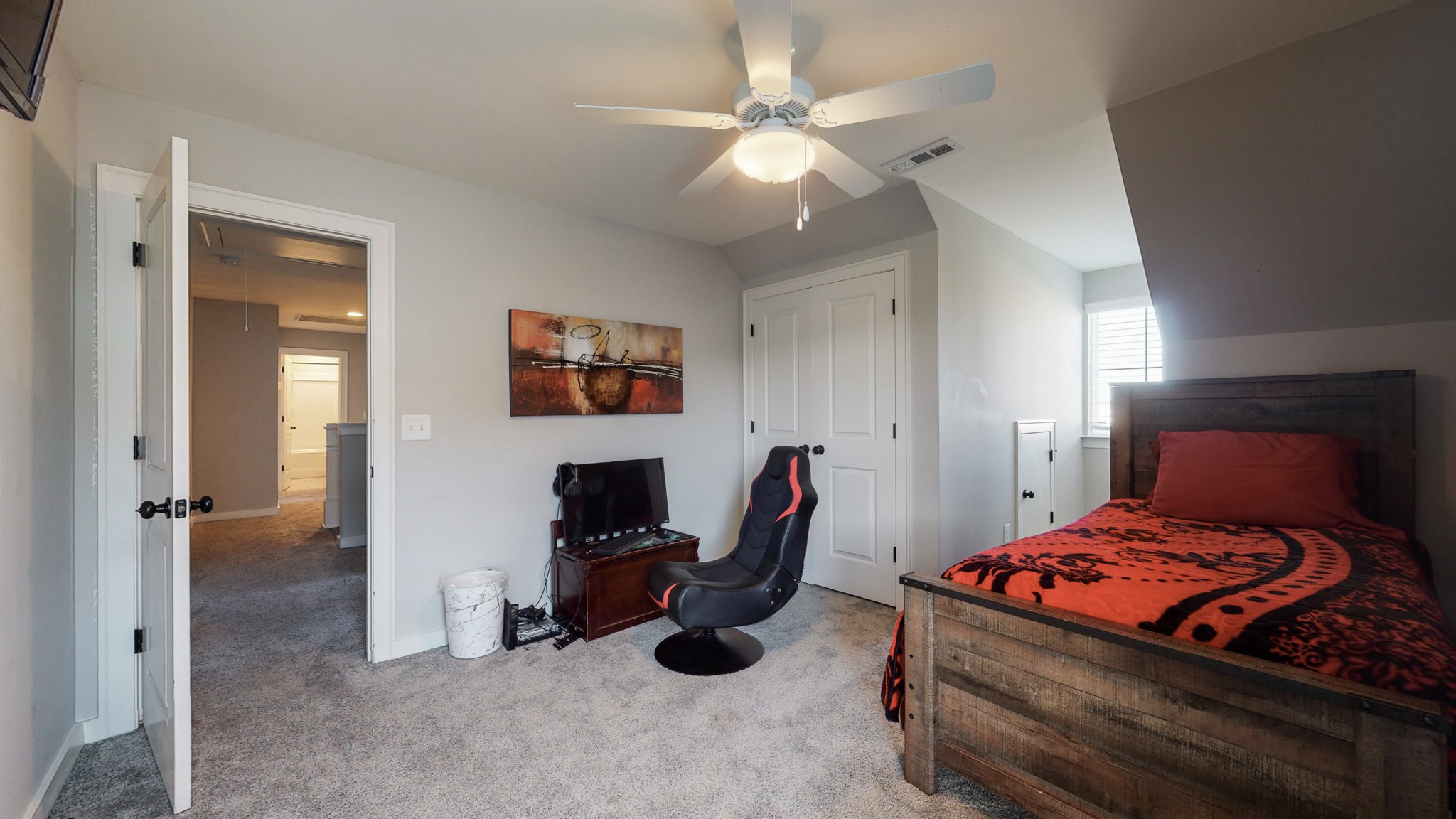 757 Plowson Road Mount Juliet, TN 37122 - Photo 29 of 48 a bedroom with a bed and a chandelier