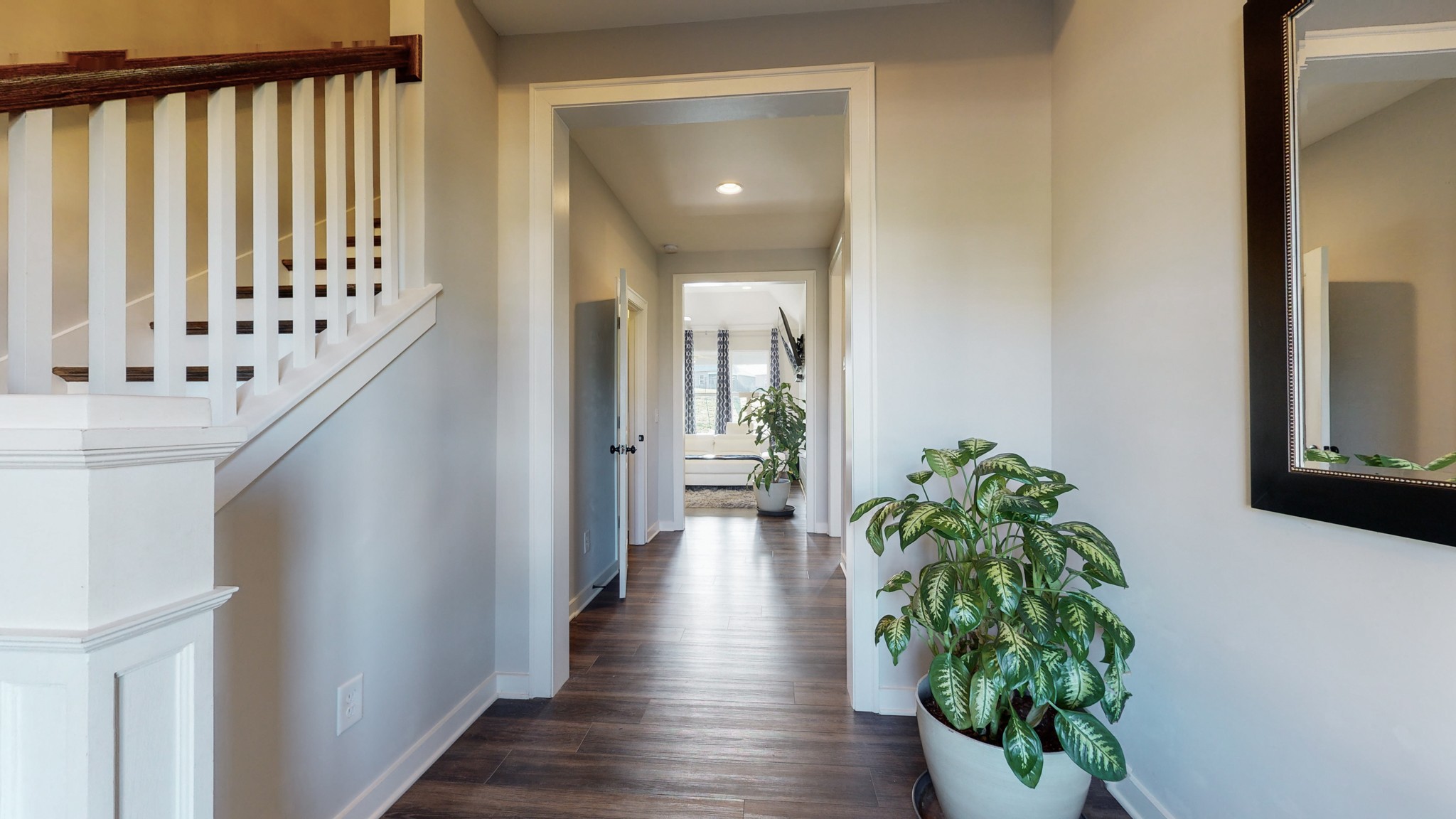 757 Plowson Road Mount Juliet, TN 37122 - Photo 10 of 48 a view of a hallway with wooden floor and stairs