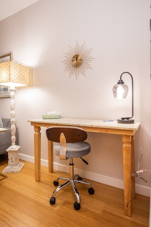 16 Miner Street, Unit 401 Boston, MA 02215 - Photo 23 of 25 a living room with a table and chairs