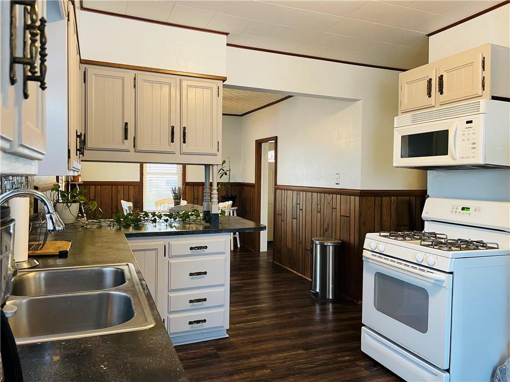 656 Browns Ferry Road Carmichaels, PA 15320 - Photo 9 of 22 a kitchen with granite countertop a sink a stove and cabinets