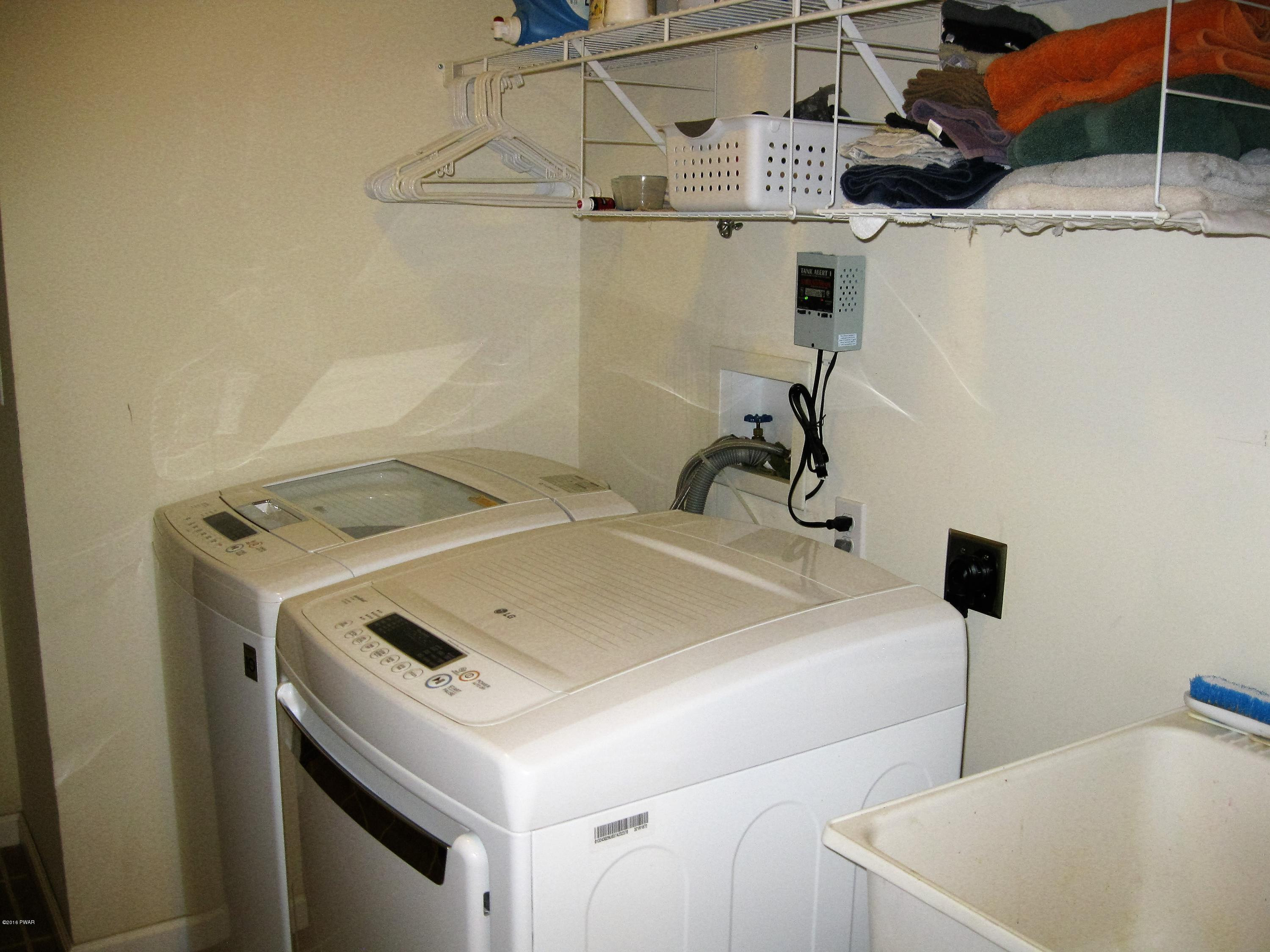 137 Caribou Road Dingmans Ferry, PA 18328 - Photo 26 of 34 a utility room with dryer and washer