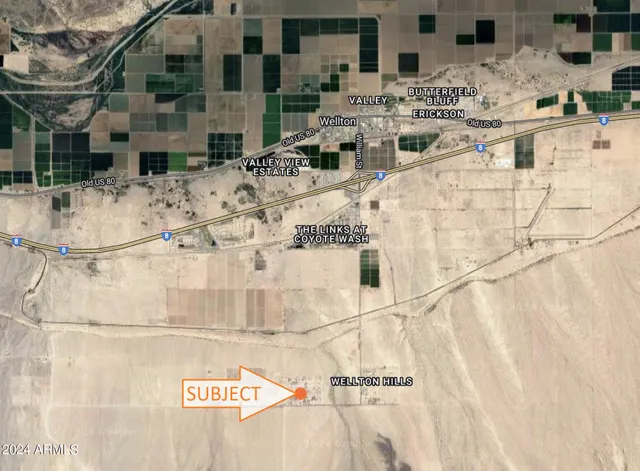 a view of kitchen with stainless steel appliances kitchen island granite countertop a refrigerator and stove