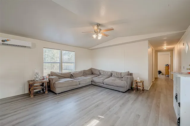 a view of a livingroom with furniture and wooden floor
