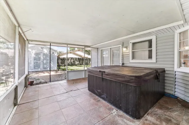 a room with a large window and a table