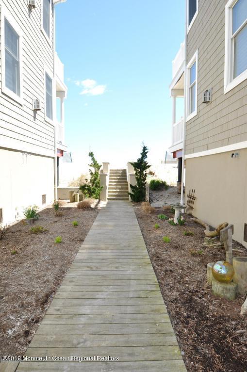 239 Beach Front, Unit 4 Manasquan, NJ 08736 - Photo 13 of 14 a view of a backyard of the house