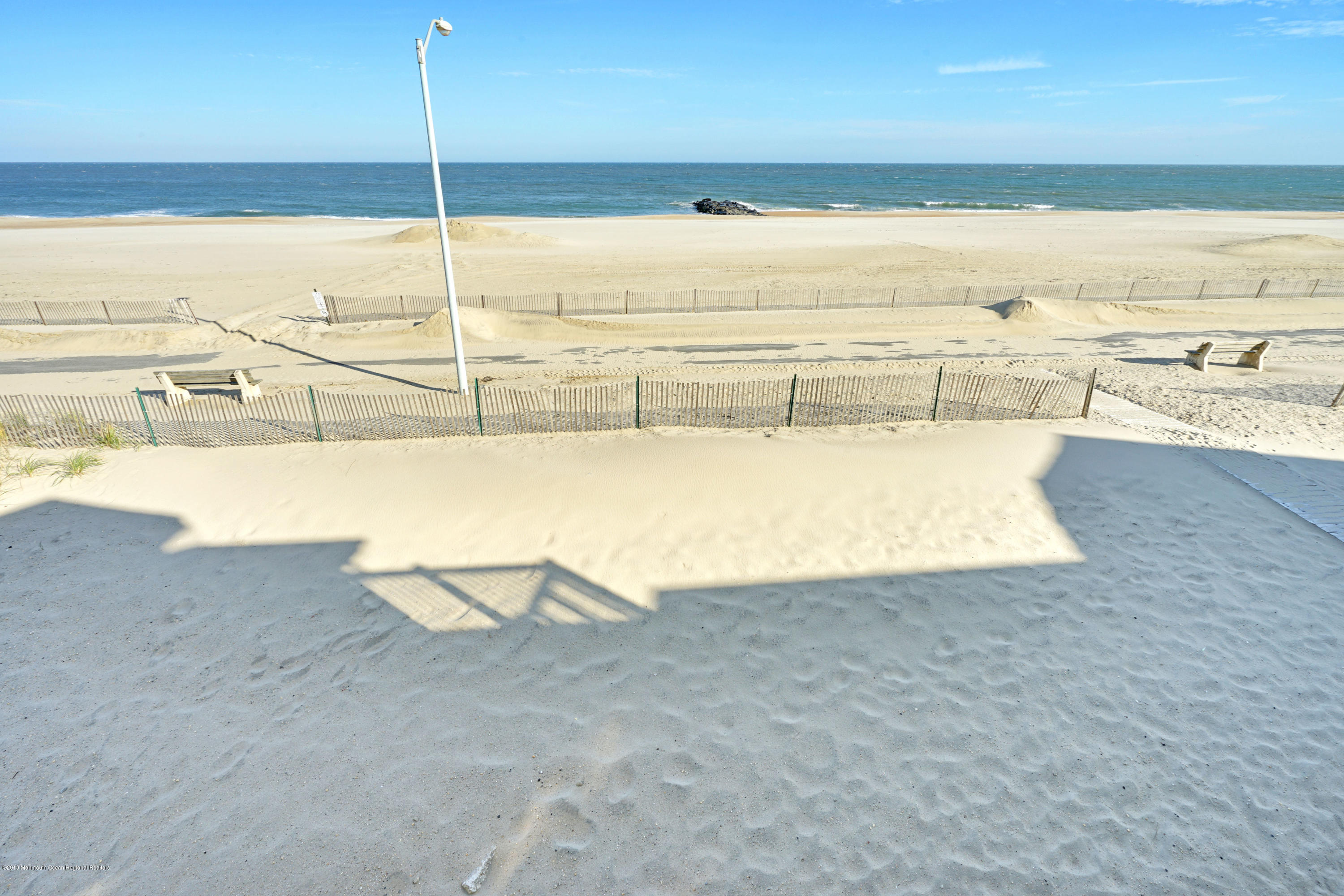 239 Beach Front, Unit 4 Manasquan, NJ 08736 - Photo 14 of 14 a view of an ocean and beach