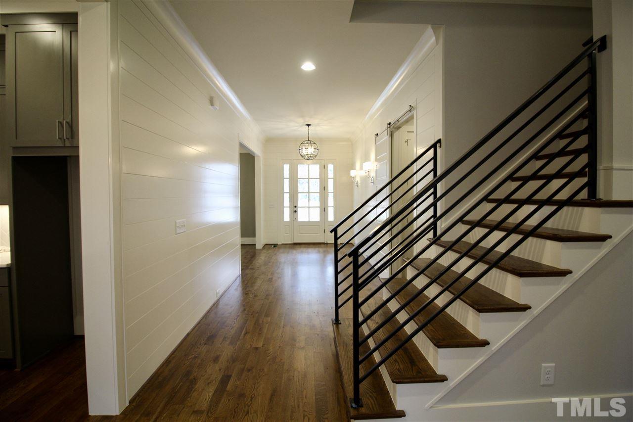 8908 Ashton Garden Way Raleigh, NC 27613 - Photo 3 of 23 a view of an entryway with wooden floor
