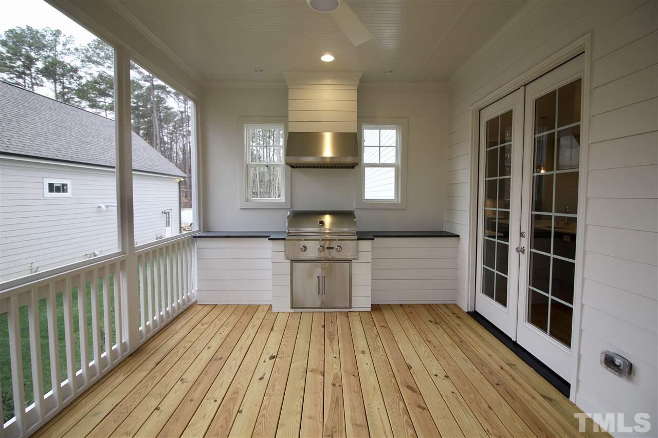 8908 Ashton Garden Way Raleigh, NC 27613 - Photo 22 of 23 a view of a kitchen with wooden floor and a window