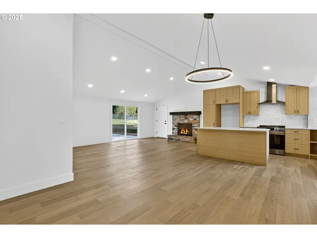 a view of kitchen with sink and microwave