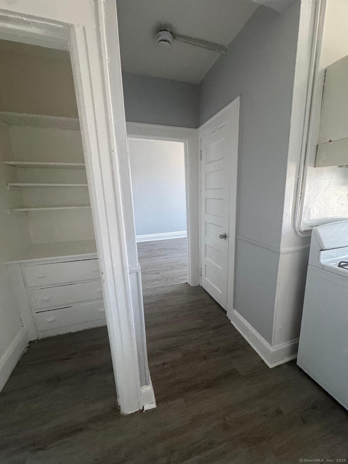 159 Charles Street, Unit 11 Bridgeport, CT 06606 - Photo 2 of 9 a view of wooden floor and staircase