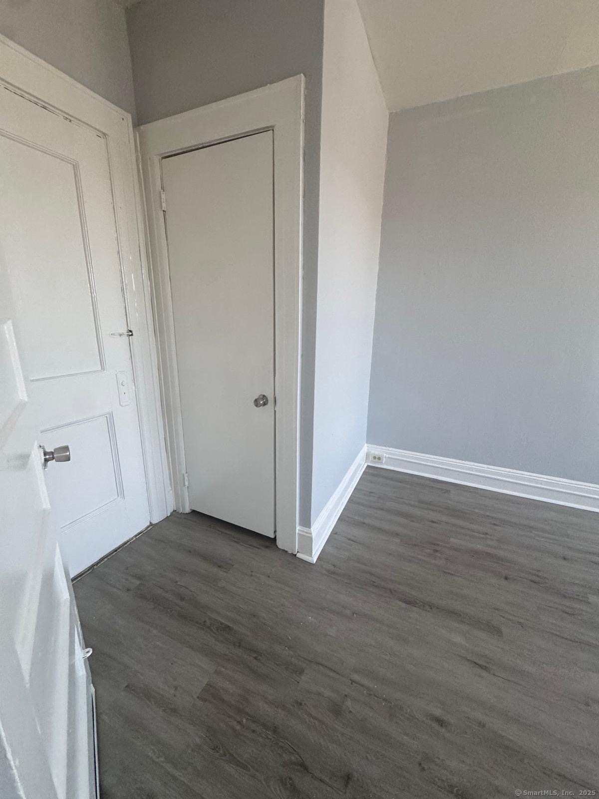 159 Charles Street, Unit 11 Bridgeport, CT 06606 - Photo 6 of 9 a view of a room with wooden floor