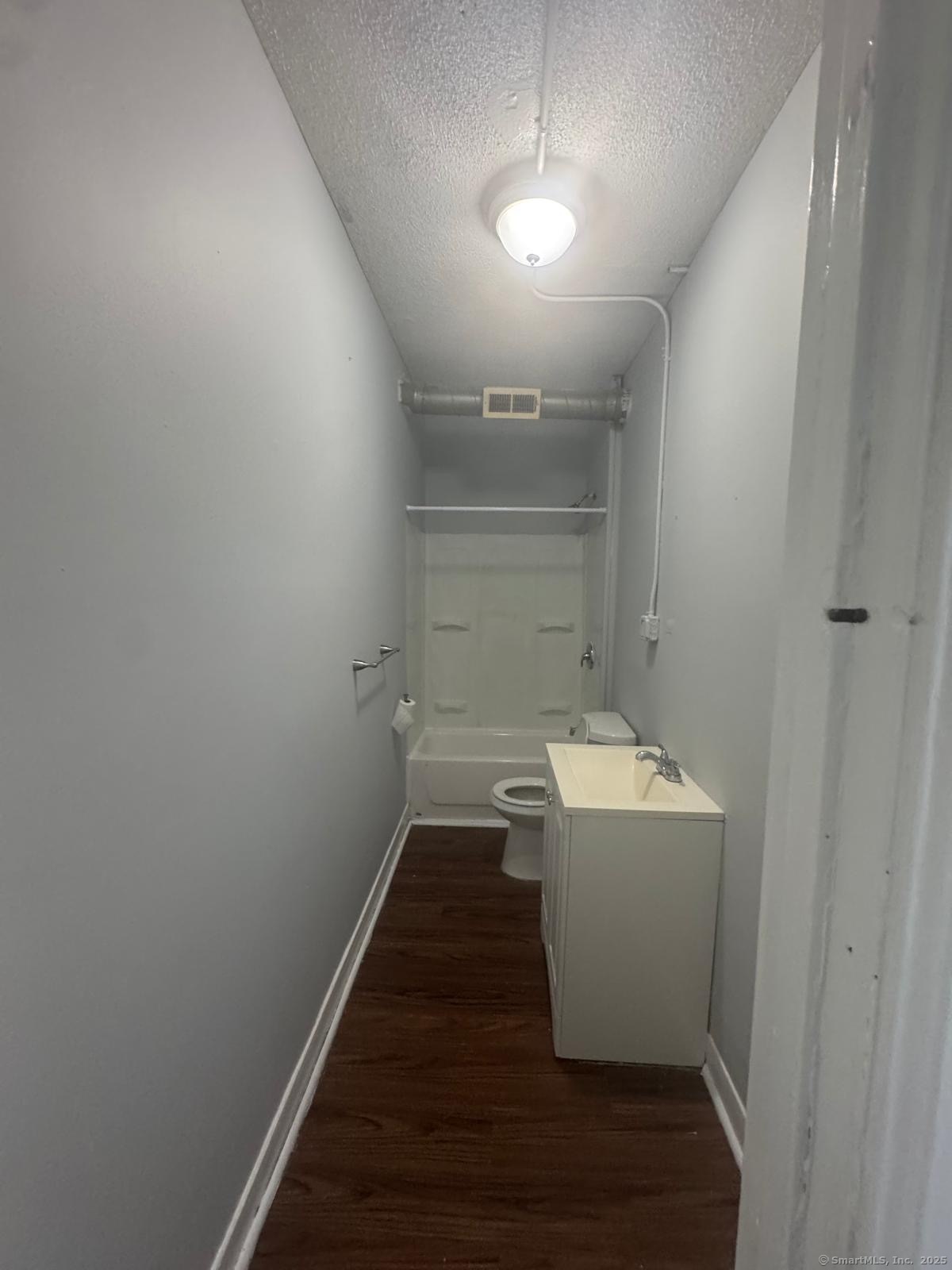 159 Charles Street, Unit 11 Bridgeport, CT 06606 - Photo 8 of 9 a view of a room with a hallway