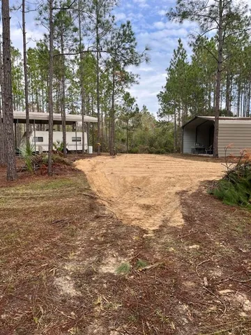a tall building with trees in front of it