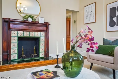 a living room with furniture and a mirror