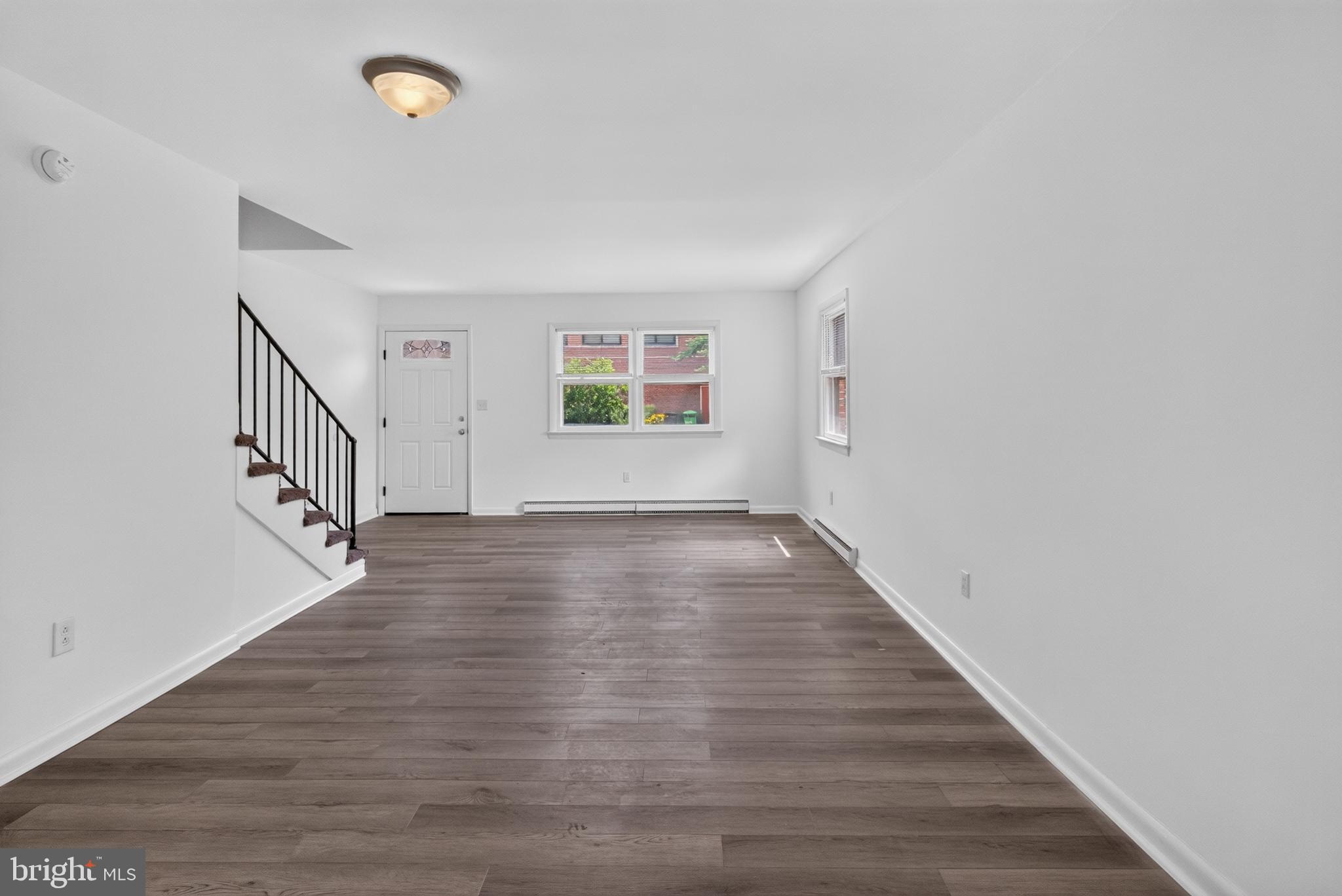 351 Calvert Street Chestertown, MD 21620 - Photo 13 of 19 a view of an empty room with wooden floor and a window