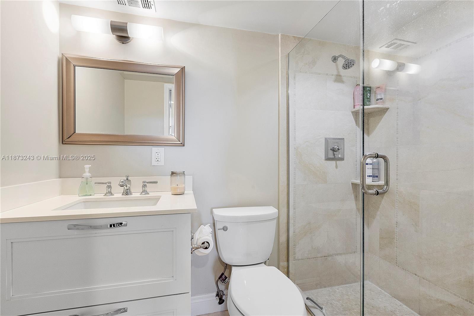5 Bluebill Avenue, Unit 701 Naples, FL 34108 - Photo 12 of 21 a bathroom with a toilet sink and shower