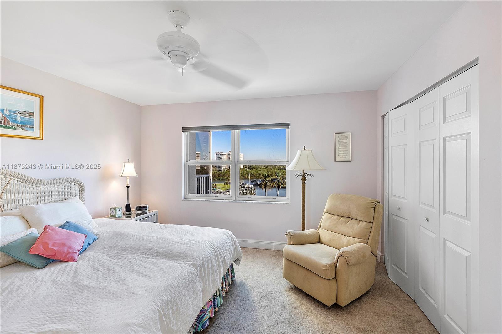 5 Bluebill Avenue, Unit 701 Naples, FL 34108 - Photo 18 of 21 a bedroom with bed and a couch