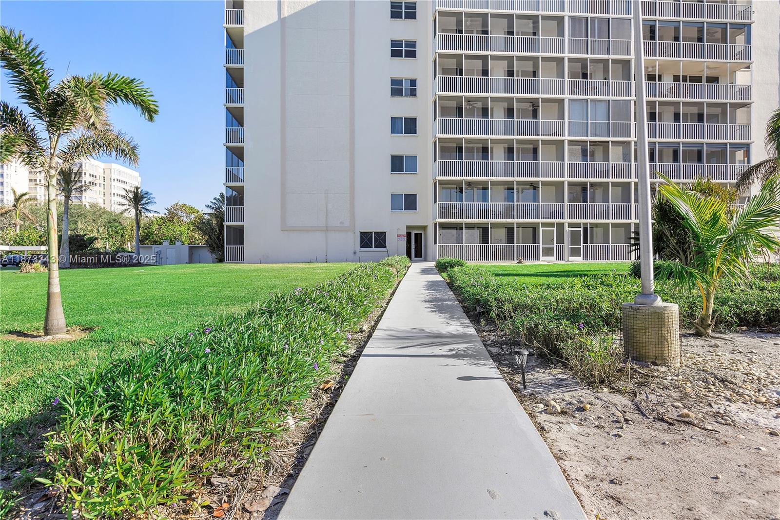 5 Bluebill Avenue, Unit 701 Naples, FL 34108 - Photo 3 of 21 a view of a building with garden