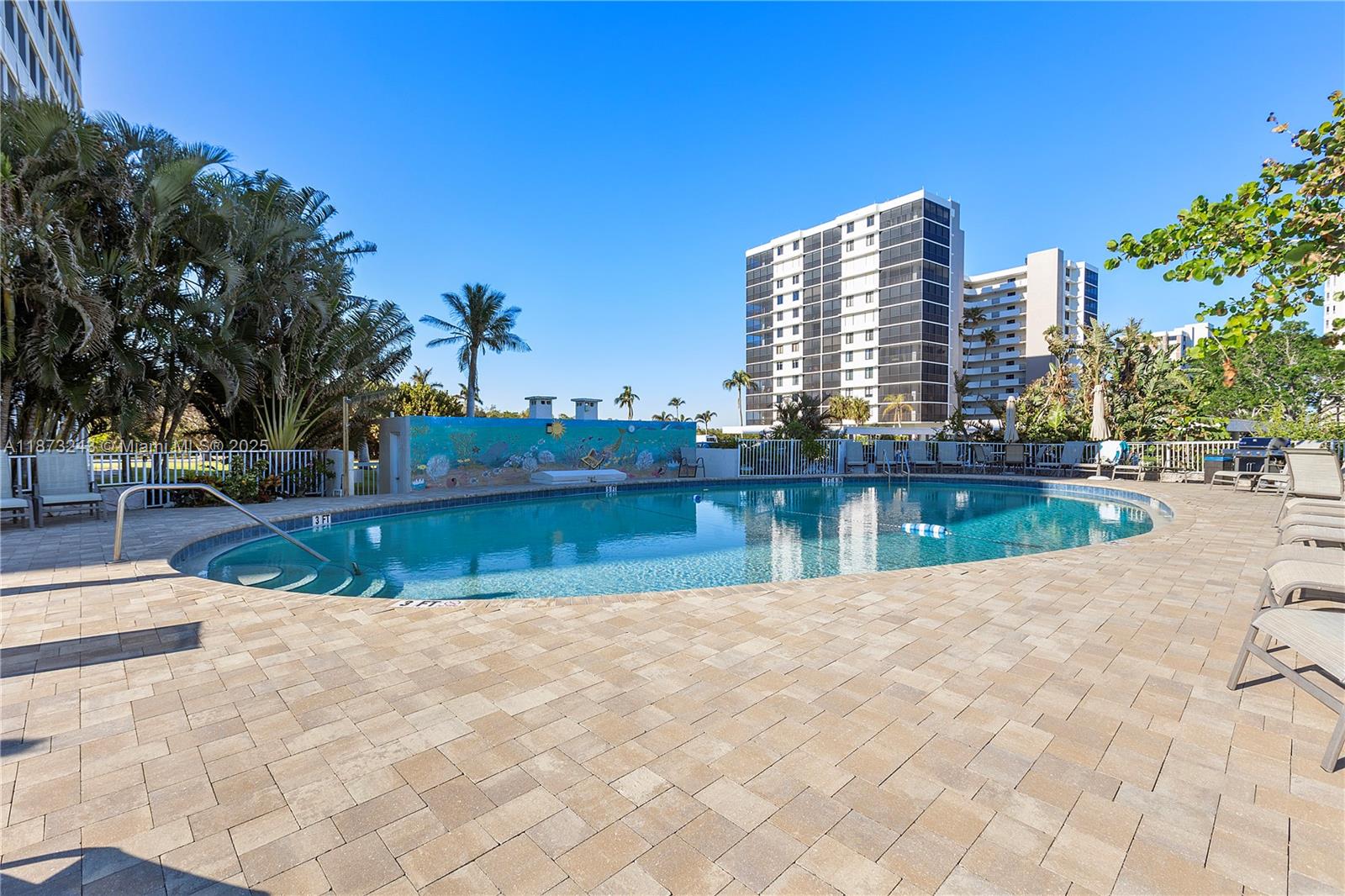 5 Bluebill Avenue, Unit 701 Naples, FL 34108 - Photo 5 of 21 a view of swimming pool with a yard