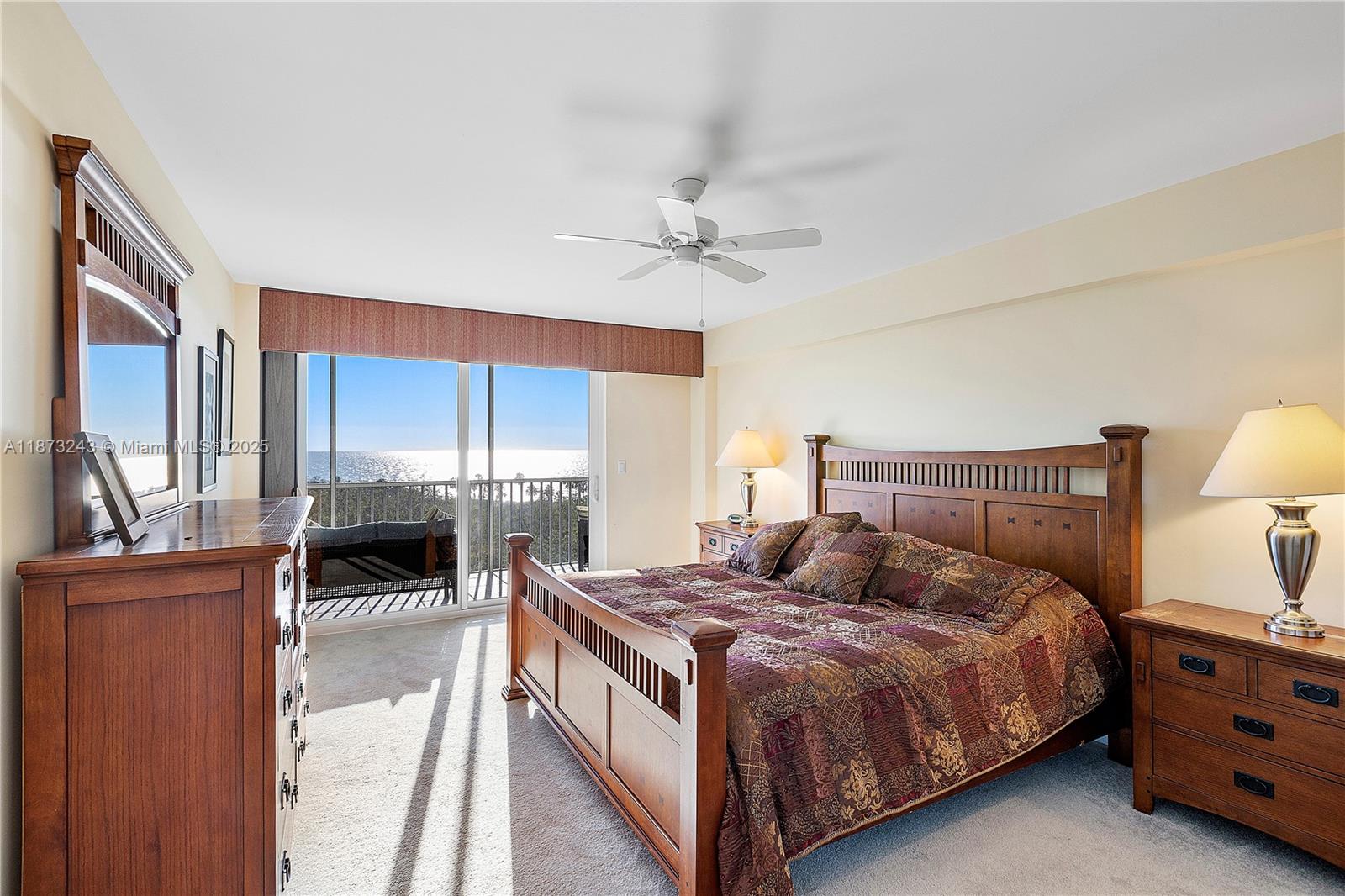 5 Bluebill Avenue, Unit 701 Naples, FL 34108 - Photo 10 of 21 a bedroom with a bed a window and dresser