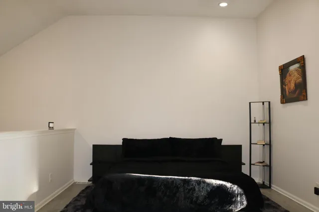 a living room with furniture and a gate