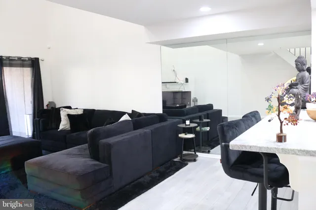 a living room with furniture and a table