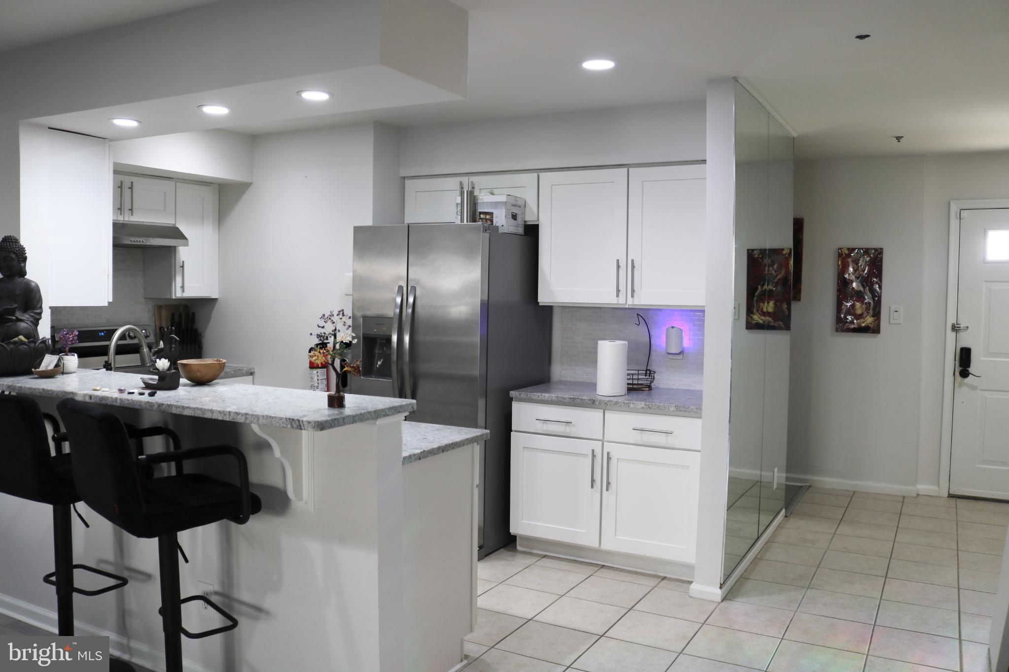 1031 Main Street Voorhees, NJ 08043 - Photo 2 of 32 a kitchen with a sink stainless steel appliances and cabinets