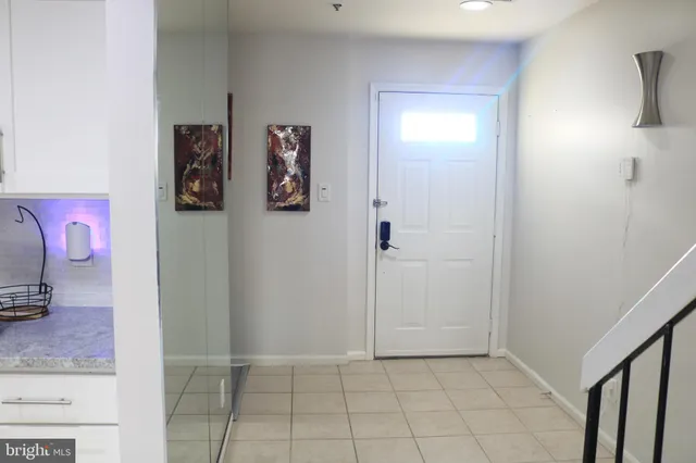 a view of an entryway with wooden floor