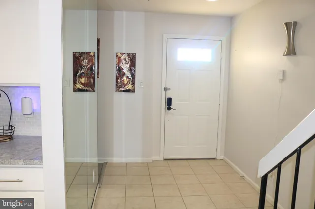 a view of a hallway with paintings on the wall