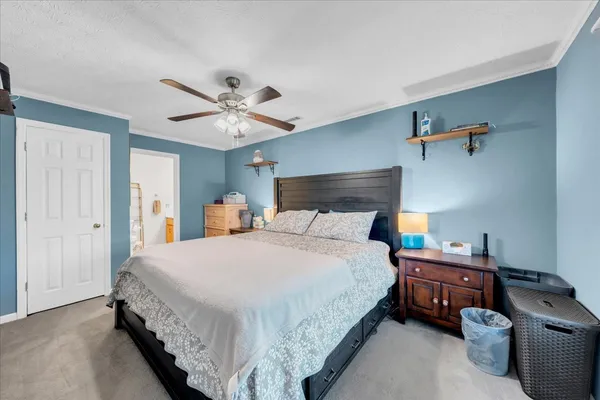 a bedroom with bed and window