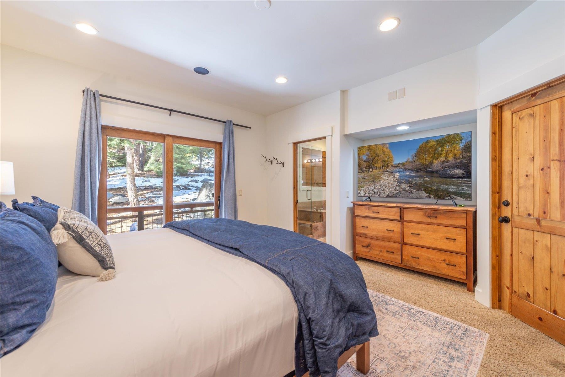 50830 Red Fir Terrace Soda Springs, CA 95728 - Photo 14 of 28 a bedroom with a bed and large window