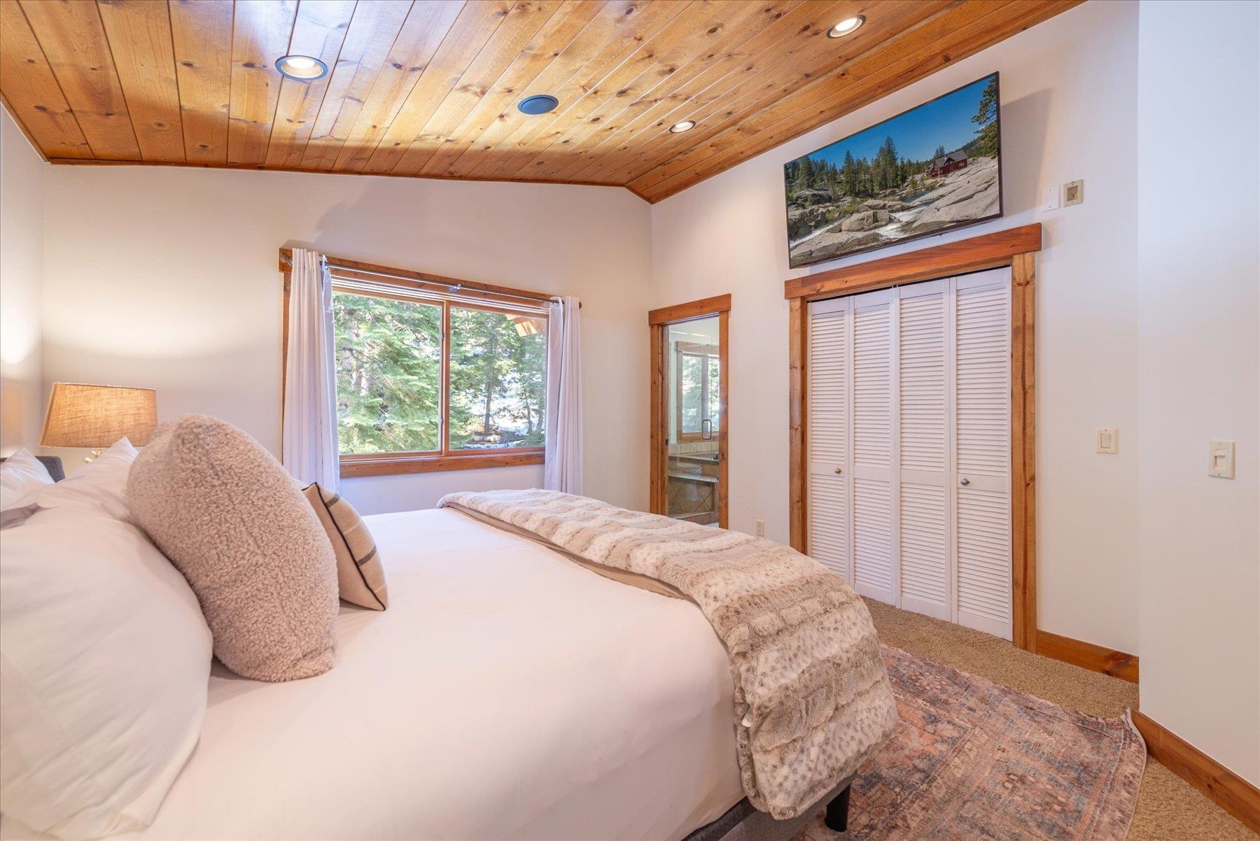 50830 Red Fir Terrace Soda Springs, CA 95728 - Photo 15 of 28 a bedroom with a bed and a window