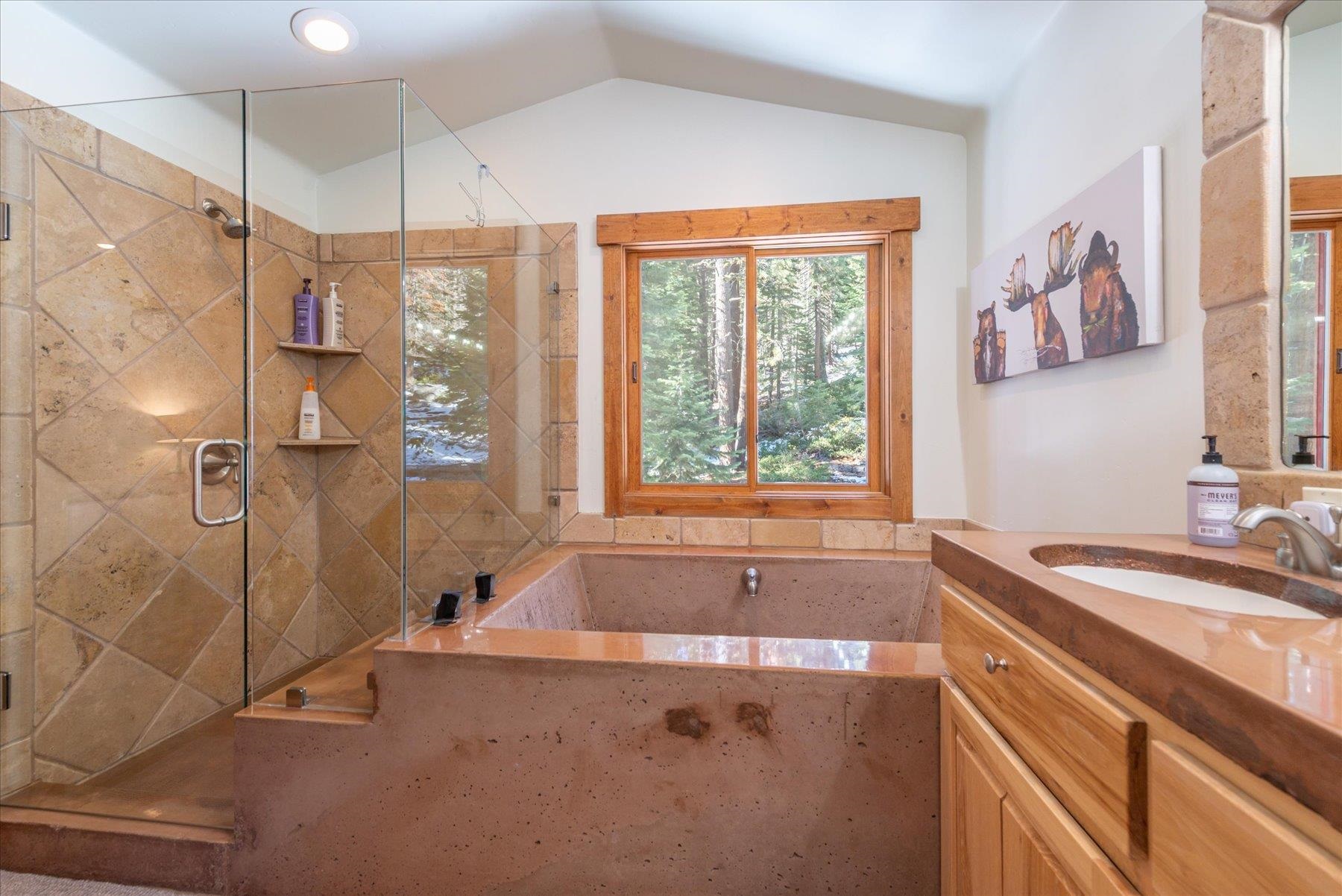 50830 Red Fir Terrace Soda Springs, CA 95728 - Photo 16 of 28 a bathroom with a granite countertop sink a bathtub and shower