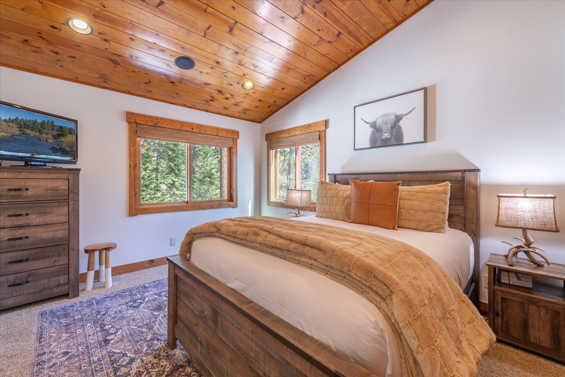 50830 Red Fir Terrace Soda Springs, CA 95728 - Photo 17 of 28 a bedroom with a bed and a dresser