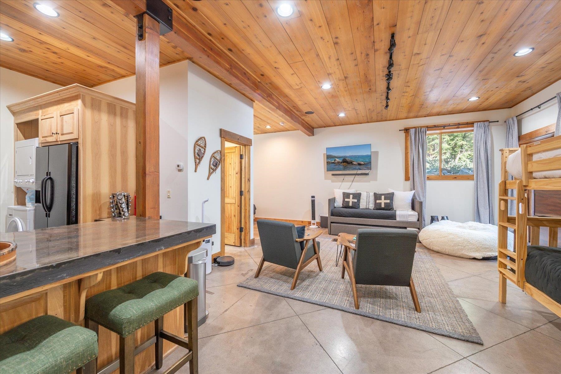 50830 Red Fir Terrace Soda Springs, CA 95728 - Photo 24 of 28 a living room with furniture a large window and stainless steel appliances