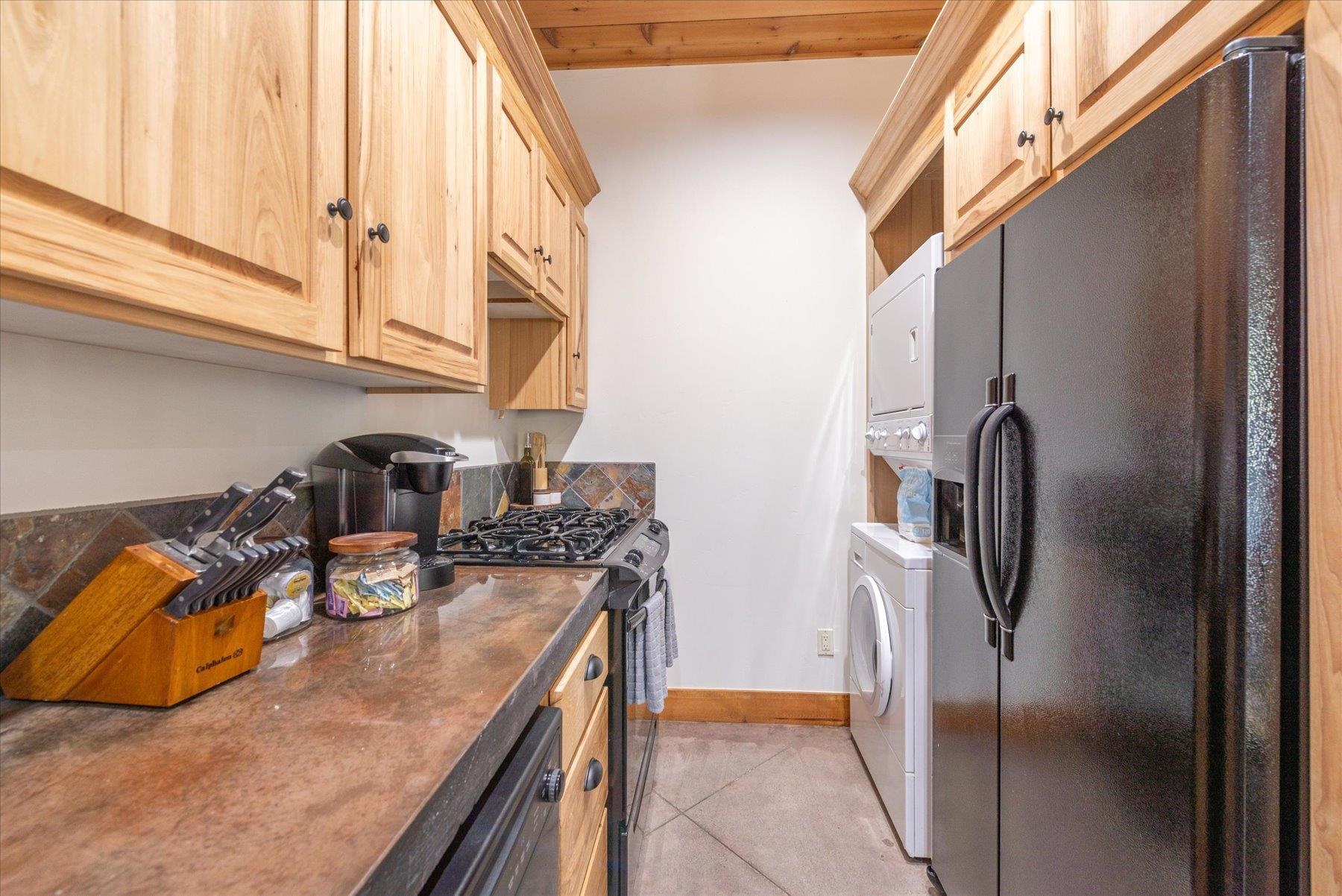 50830 Red Fir Terrace Soda Springs, CA 95728 - Photo 25 of 28 a kitchen with stainless steel appliances granite countertop a sink a refrigerator and a stove