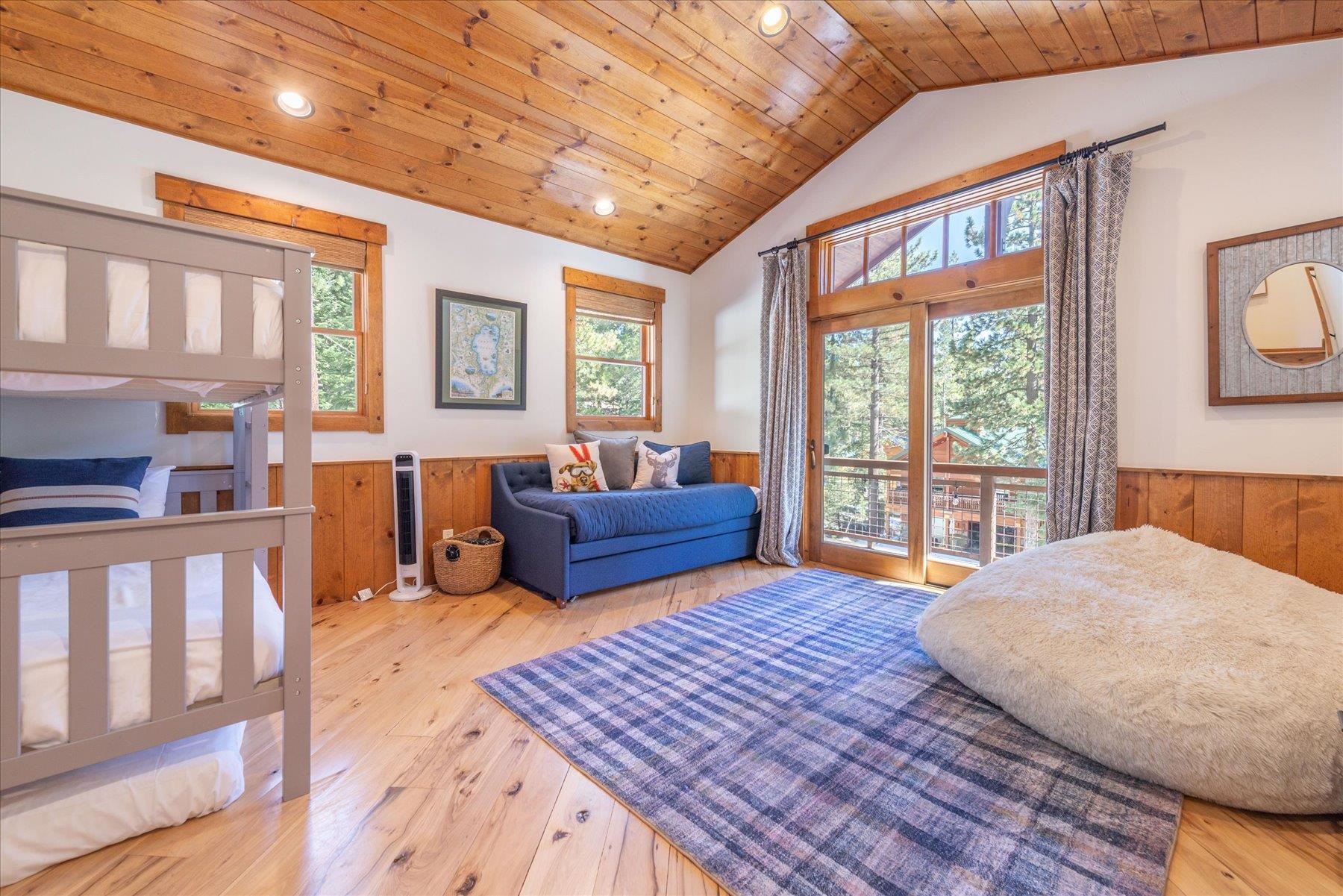 50830 Red Fir Terrace Soda Springs, CA 95728 - Photo 9 of 28 a bedroom with furniture and a large window