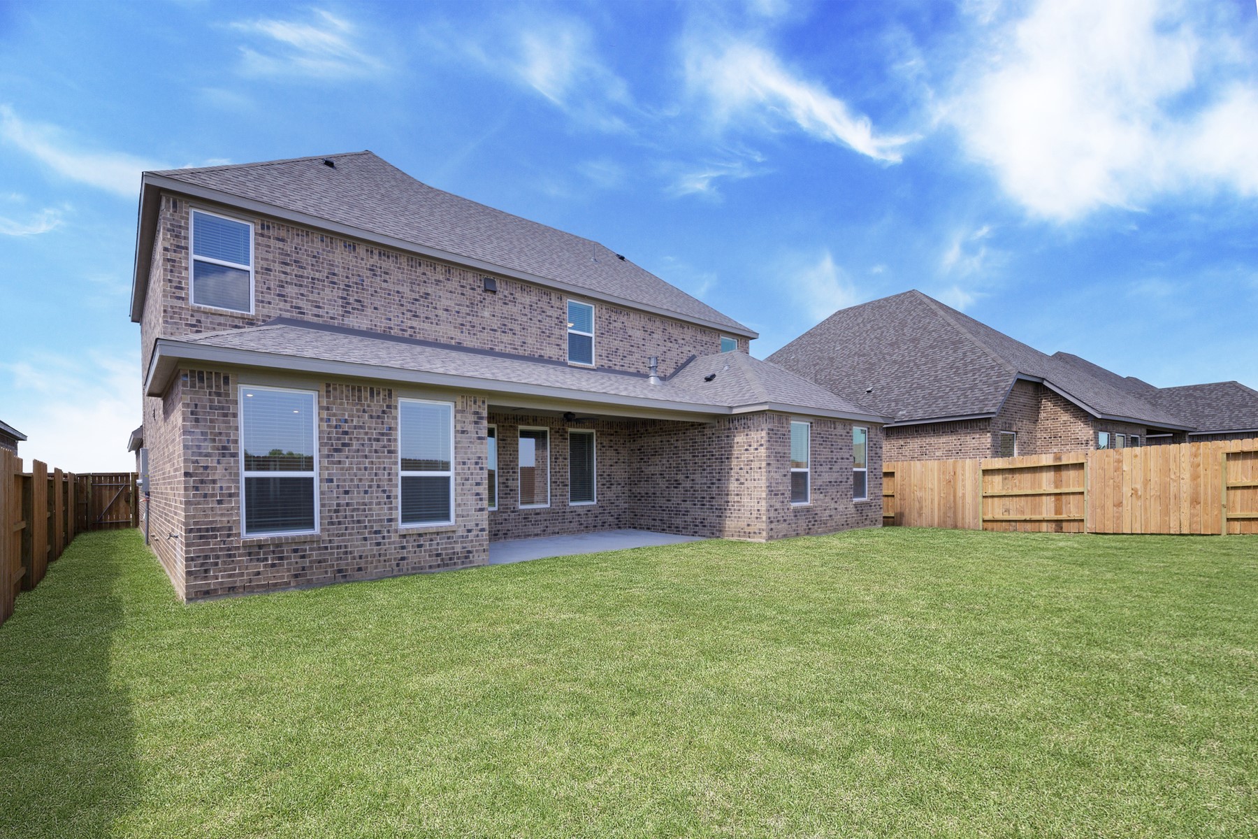 10503 Sutter Crk Drive Iowa Colony, TX 77583 - Photo 12 of 16 a view of a brick house with a big yard and large trees