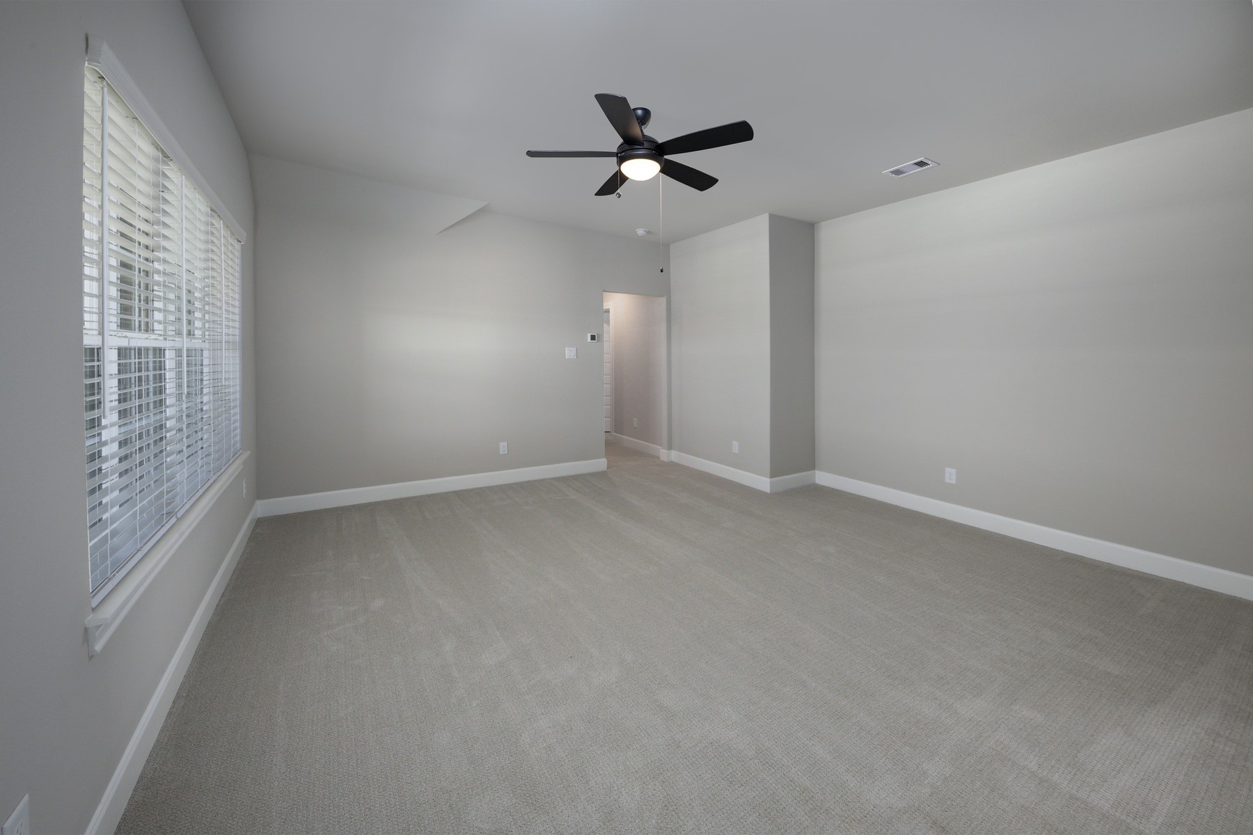 10503 Sutter Crk Drive Iowa Colony, TX 77583 - Photo 9 of 16 a view of room with window and ceiling fan